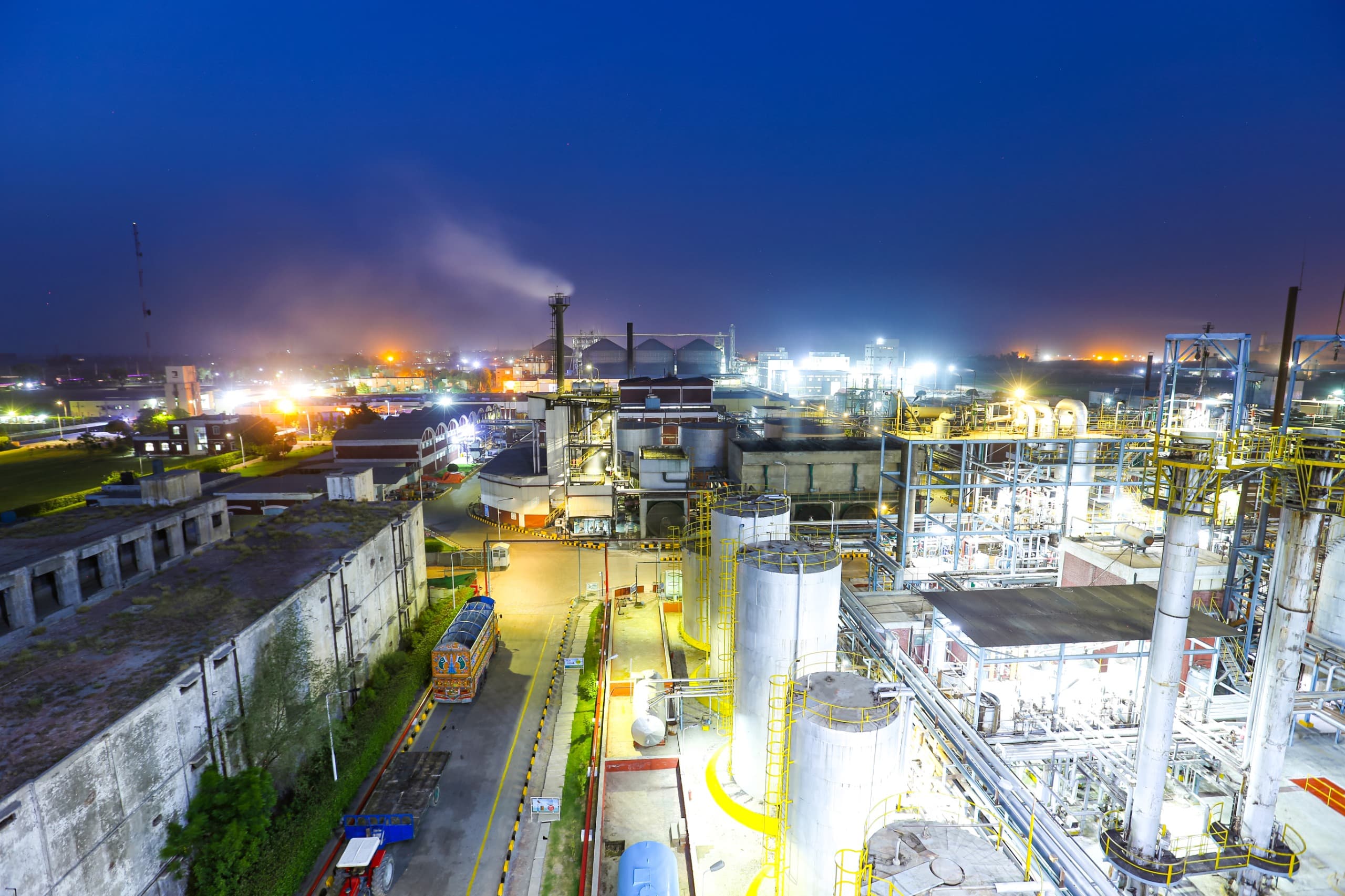 Nimbess manufacturing facility at twilight — wide aerial view